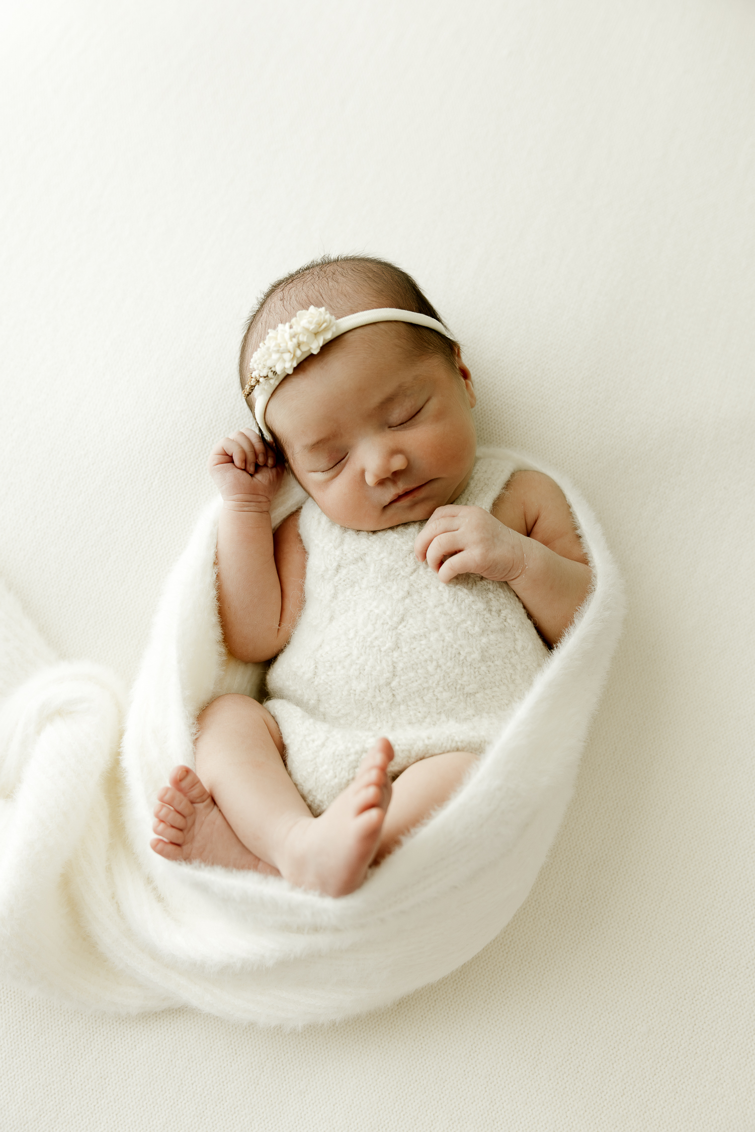 sleeping baby in a wrap
